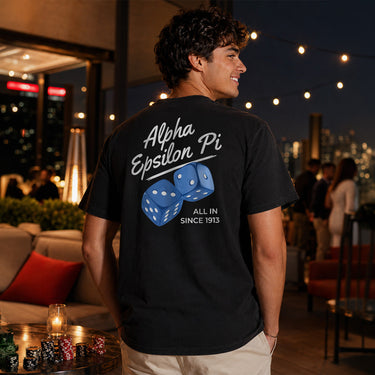Model wearing the High Roller Tee from the back, featuring a full back dice graphic on a black Comfort Colors tee.