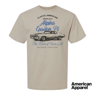 Beige T-shirt displayed on a plain background with a vintage-inspired graphic of a classic muscle car, mixed typography, and a soft red and black print design.