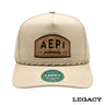 Cream Legacy brand rope hat featuring a brown fraternity patch, designed for stylish fraternity apparel and casual campus wear.