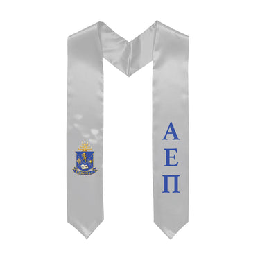 White graduation stole decorated with Greek letters and Coat of Arms